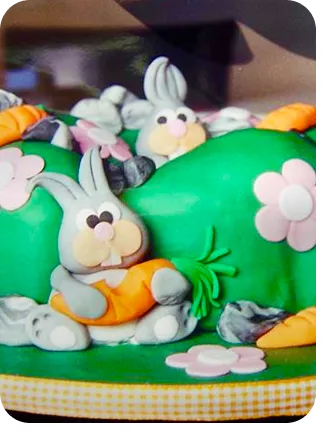 Bolo de 1 andar sem forma no tema Páscoa com cores fortes com coelhos espalhados entre os bolos do Curso Meu Primeiro Zoológico - Modele 25 Animais em Pasta Americana